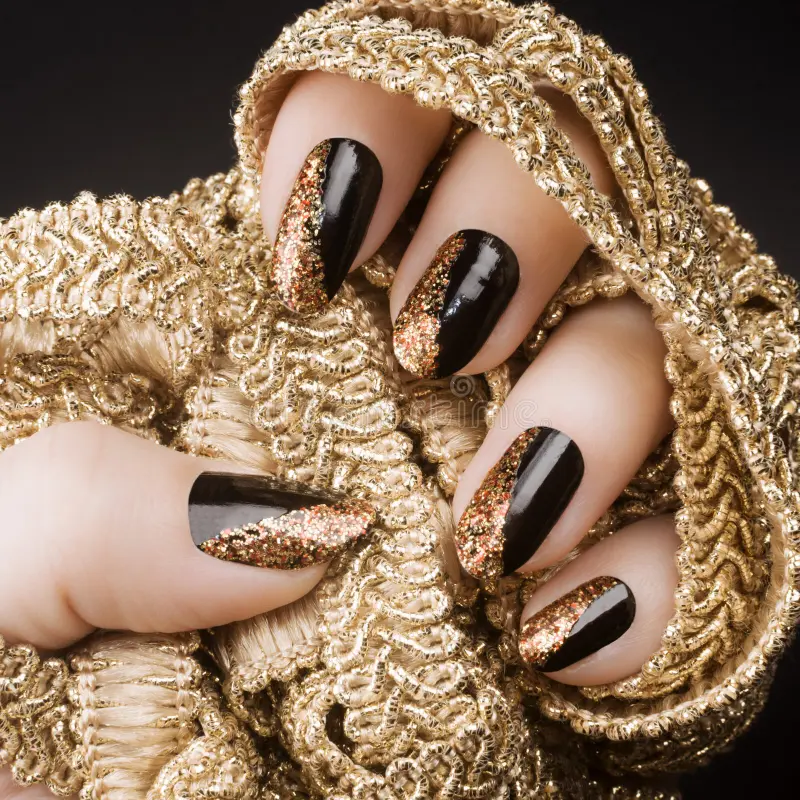 golden-black-nails-female-hand-golden-black-nails-holding-gold-decoration-black-background-manicure-nail-art-141396116